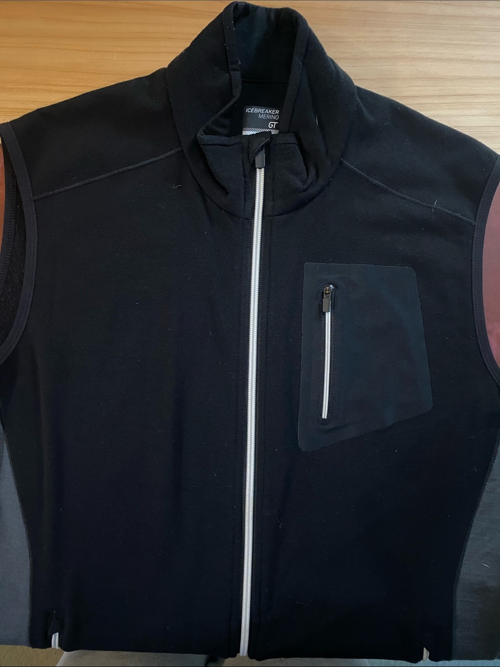Icebreaker Black Merino Wool Full-Zip Vest with Chest Zip Pocket and side panels - Picture 8 of 9
